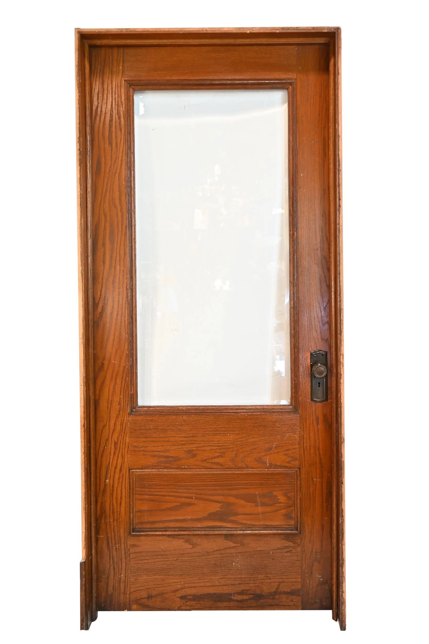 oak 15 lite french doors in jam with hardware featuring milk glass
